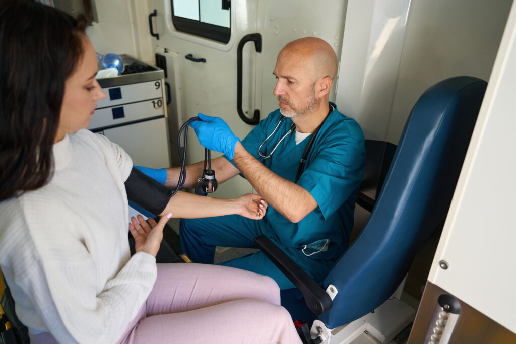 man taking woman s blood pressure in medical setti 2026 03 20 00 27 54 utc