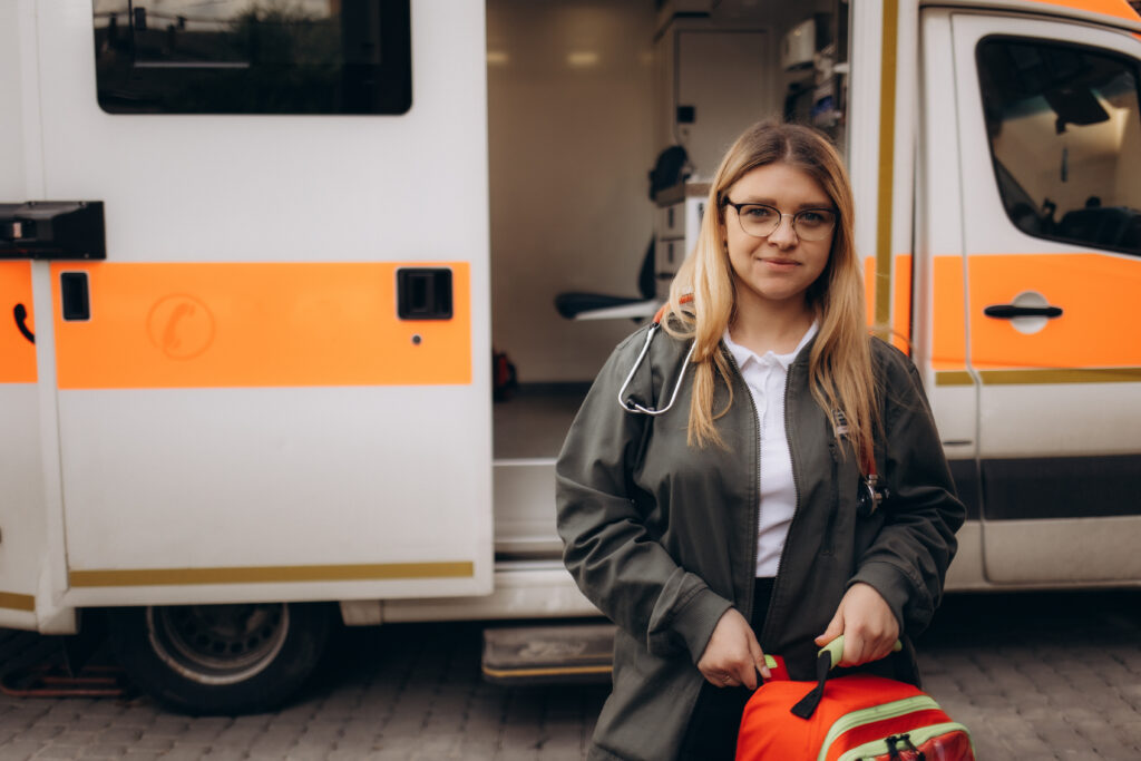 medical professional with ambulance standing outsi 2026 03 24 04 05 17 utc