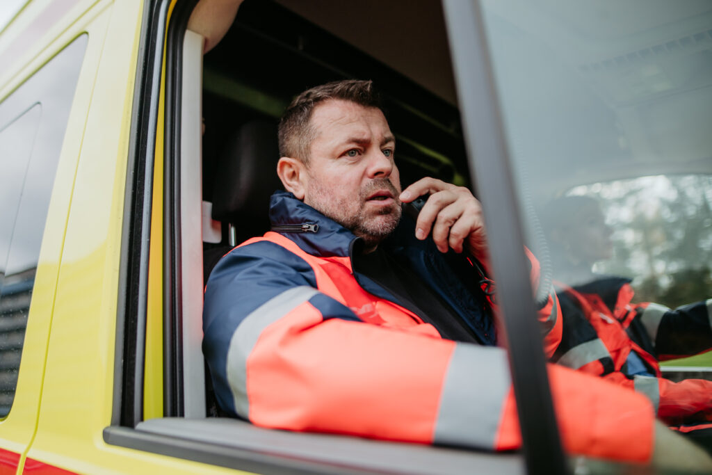paramedic driving an ambulance speaking into radi 2026 03 10 03 54 24 utc
