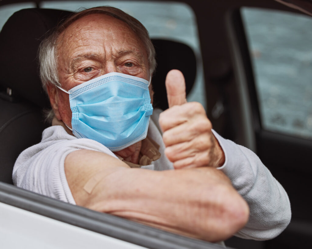 senior man in car showing post vaccination approva 2026 09 22 05 23 54 utc